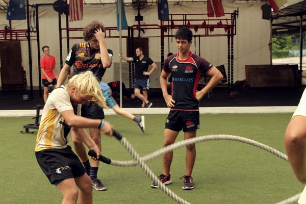 Jules training with the battle ropes at the training.