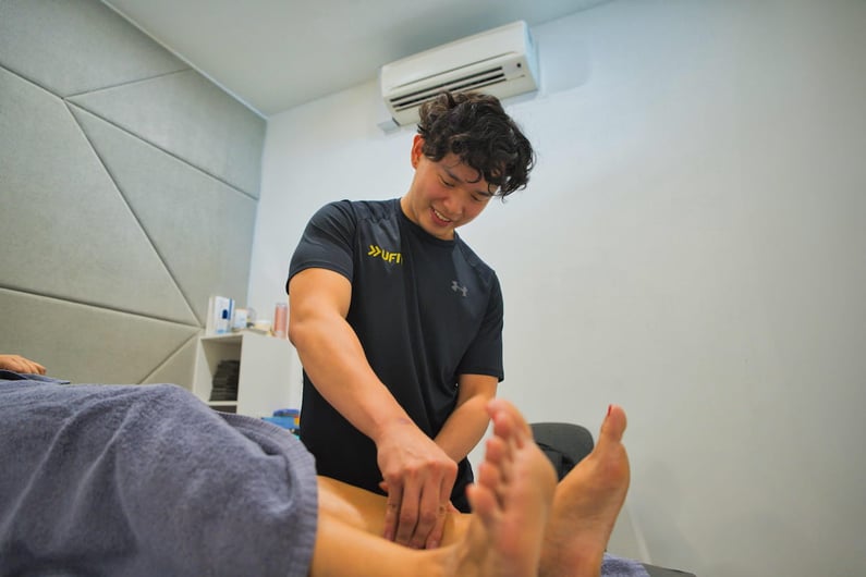 Physio assessing feet - Joshua